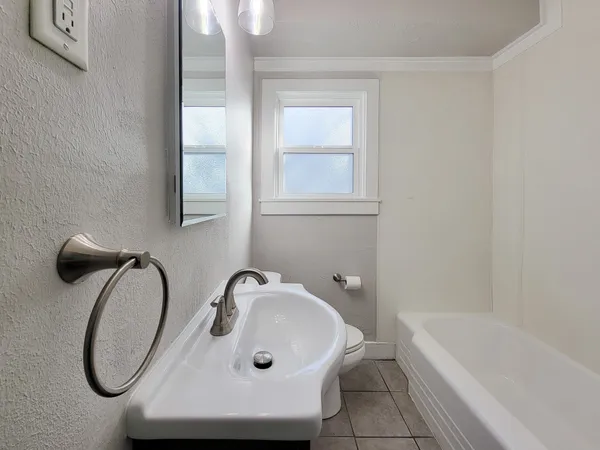 a bathroom with a sink and a bathtub