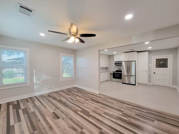 a view of an empty room with a window
