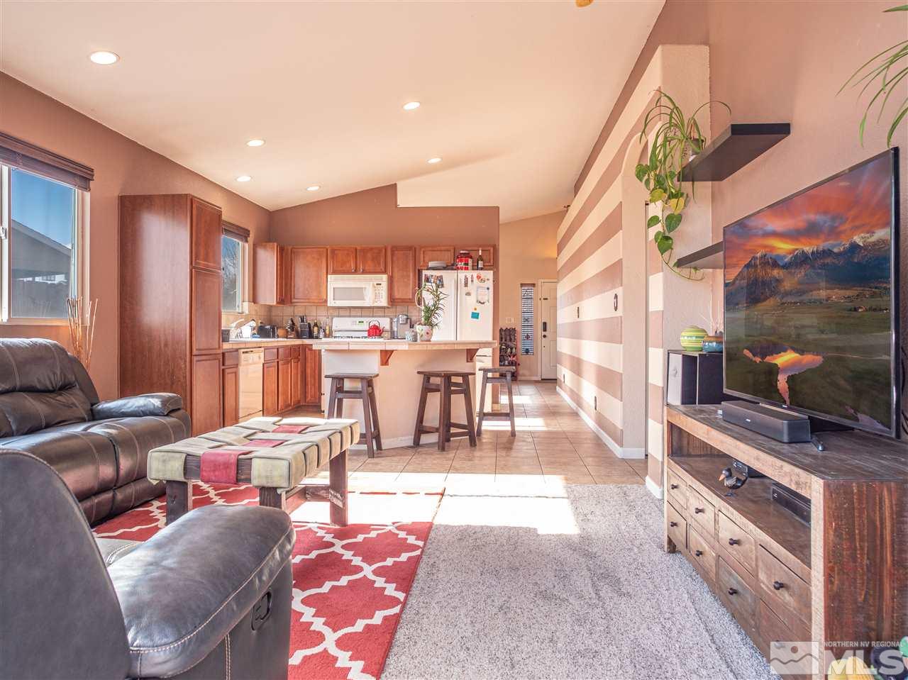10040 Stonefield Drive Reno, NV 89521 - Photo 11 of 24 a living room with stainless steel appliances furniture and a kitchen view