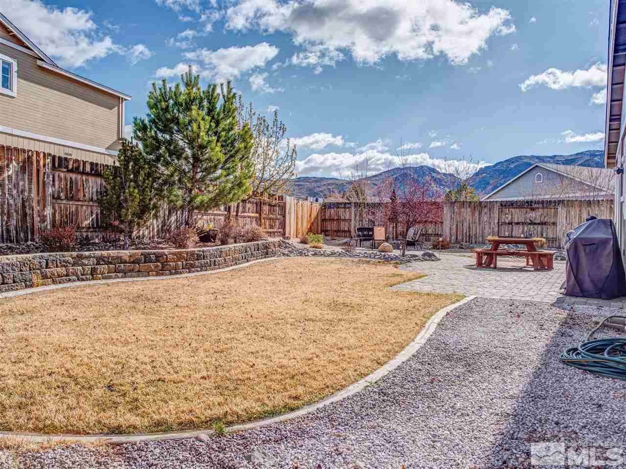 10040 Stonefield Drive Reno, NV 89521 - Photo 22 of 24 a swimming pool with outdoor seating and yard