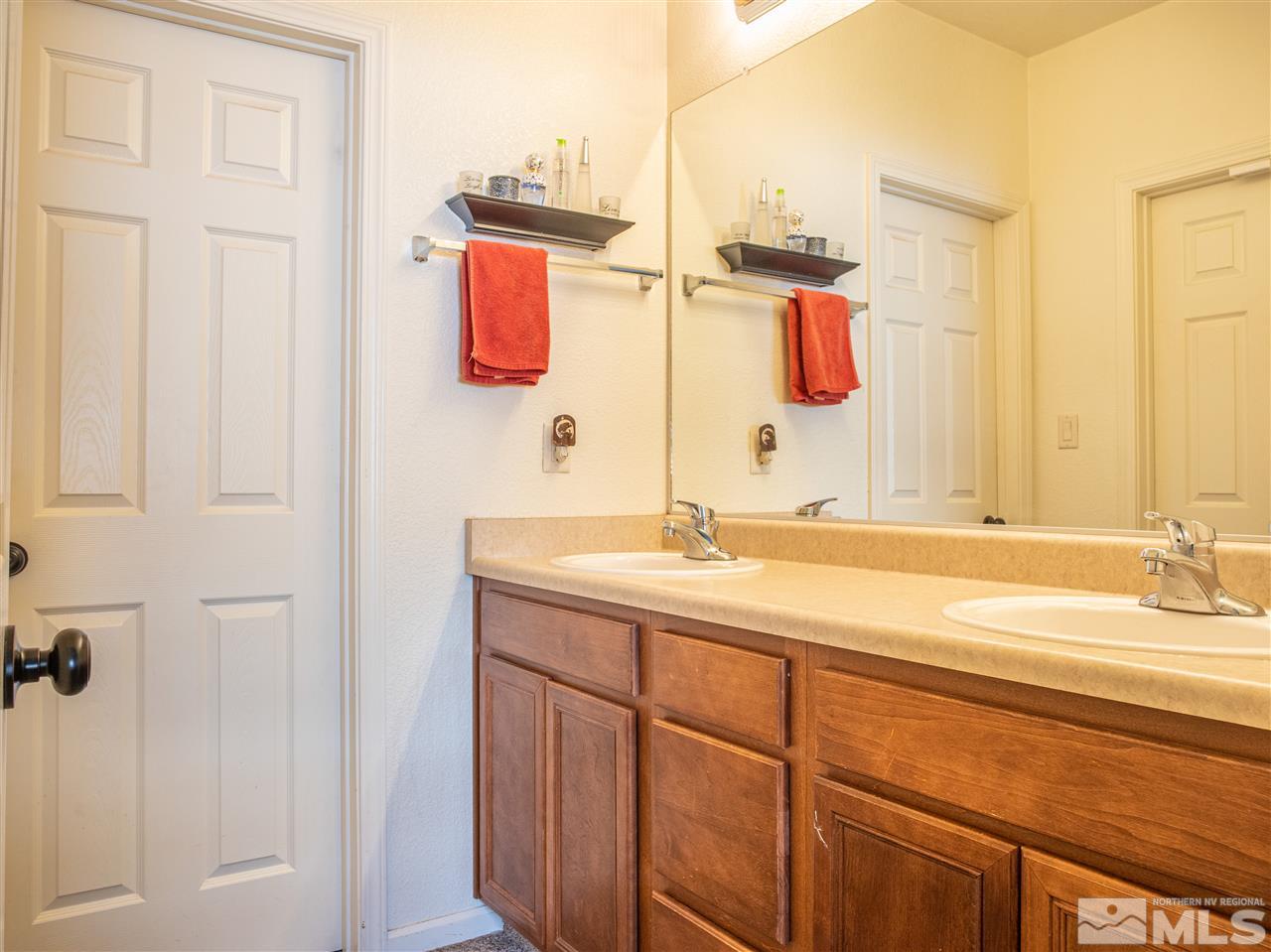 10040 Stonefield Drive Reno, NV 89521 - Photo 24 of 24 a bathroom with a sink and a mirror