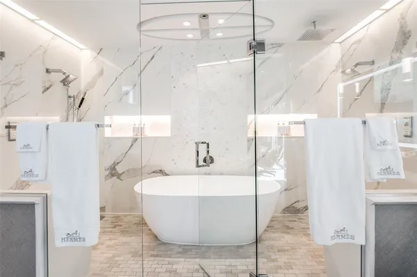 a bathroom with a sink double vanity and a mirror