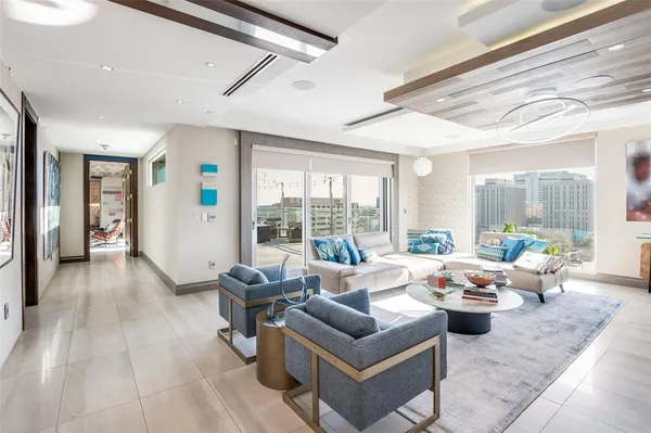 a living room with furniture and a large window