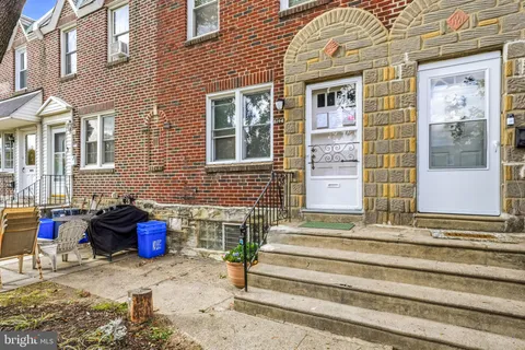 a front view of a brick building with many windows