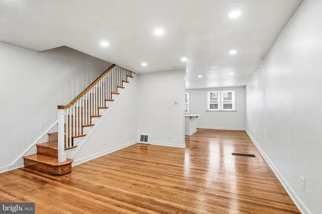 a view of entryway with wooden floor