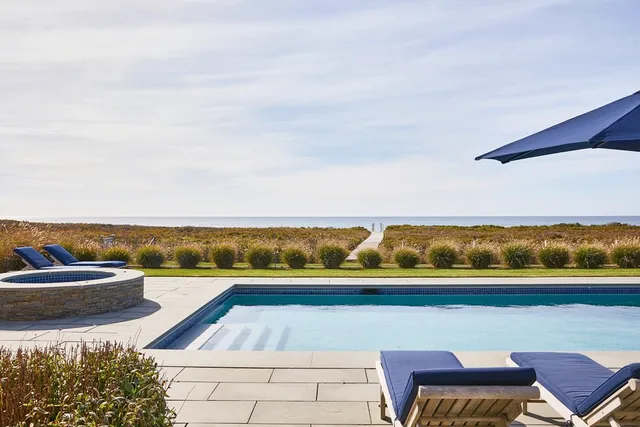 a view of swimming pool with lounge chair