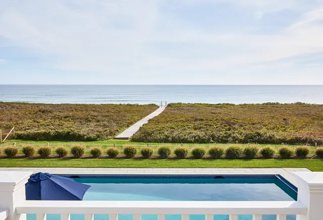 a bedroom with bed couch and window