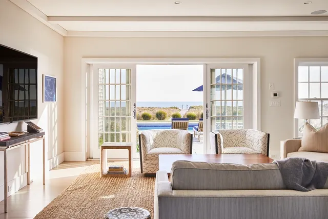 an outdoor view of house with swimming pool and seating