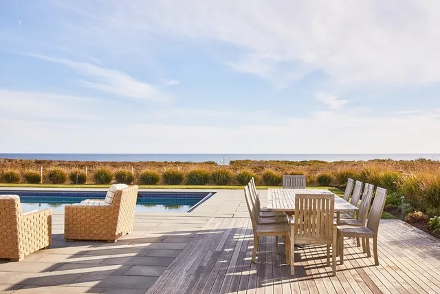 a view of a swimming pool with an ocean view
