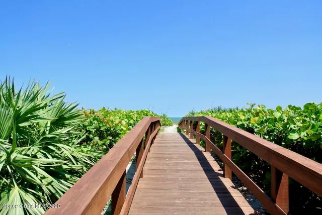 a view of balcony and yard