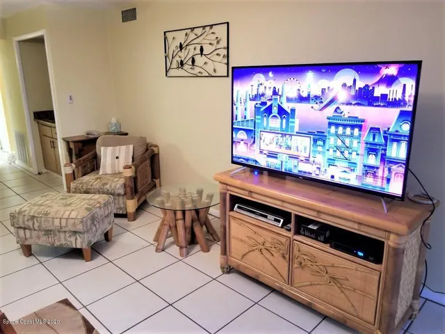 a kitchen with stainless steel appliances kitchen island granite countertop a stove and a microwave
