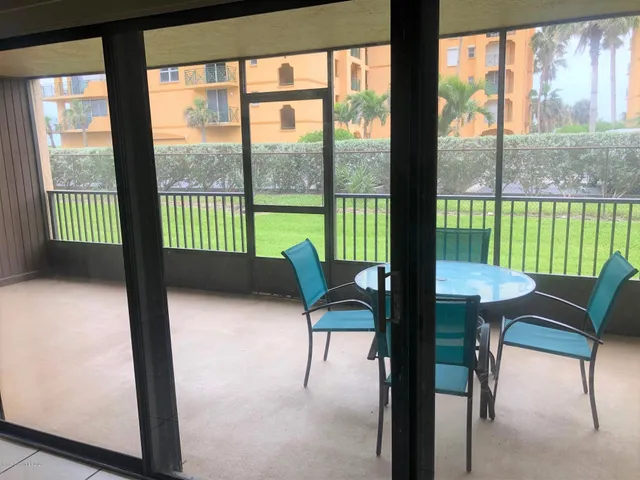 a view of a room with lounge chairs in balcony