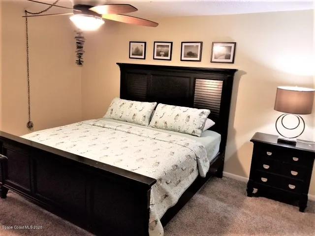 a bedroom with a bed and a closet