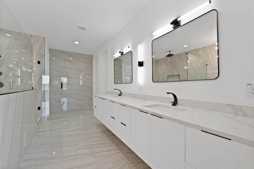443 Whispering Way Red Oak, TX 75154 - Photo 12 of 36 a bathroom with a double vanity sink mirror double and shower