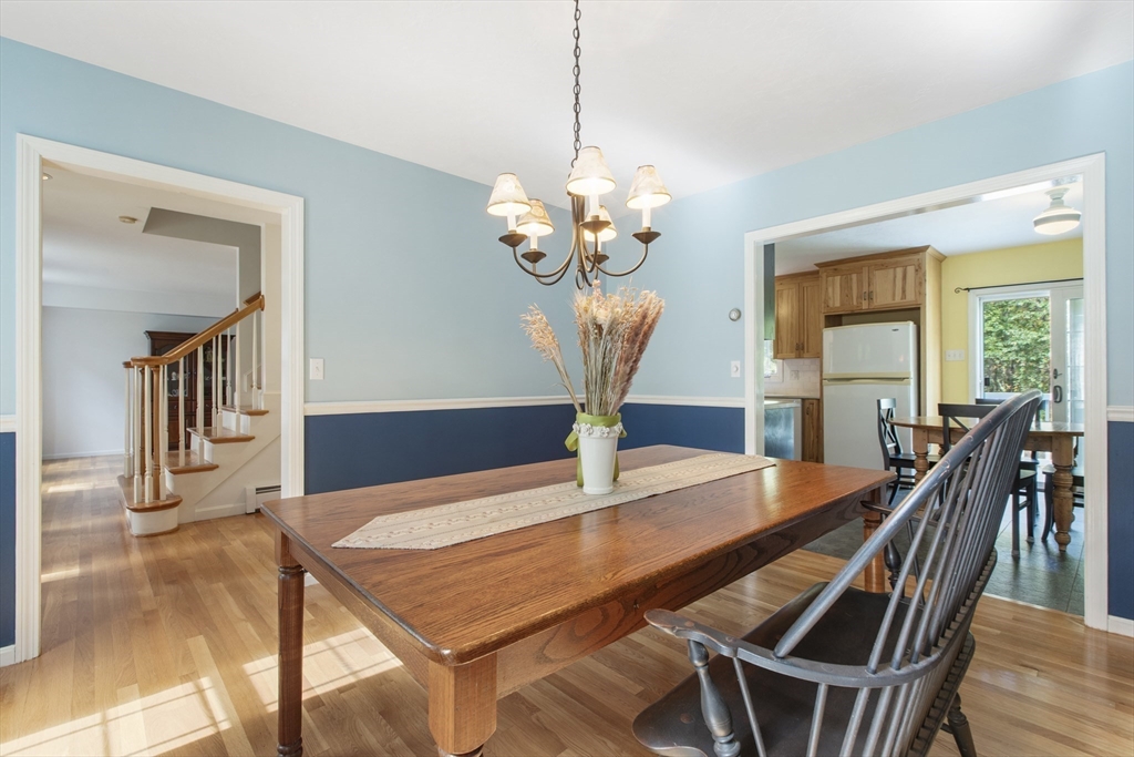 11 Old Farm Road Douglas, MA 01516 - Photo 11 of 42 a view of a dining room with furniture wooden floor and chandelier