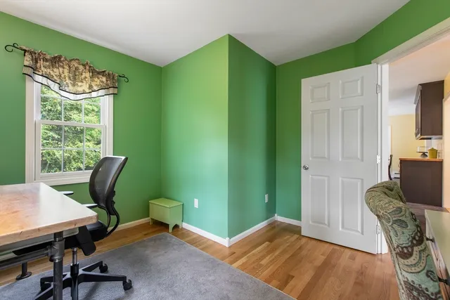 a workspace with furniture and a window