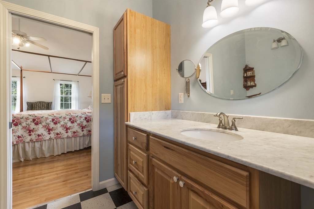 11 Old Farm Road Douglas, MA 01516 - Photo 25 of 42 a en suite bathroom with a granite countertop sink and a mirror