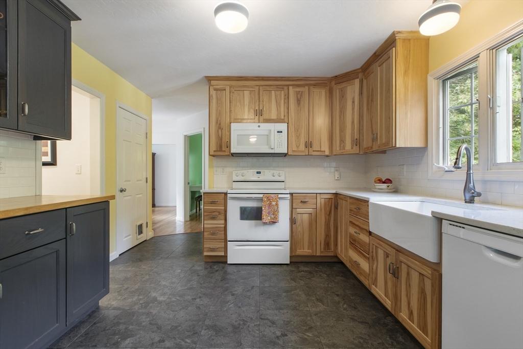 11 Old Farm Road Douglas, MA 01516 - Photo 3 of 42 a kitchen with stainless steel appliances granite countertop a stove a sink and a microwave