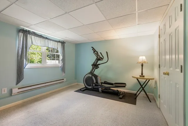 a room with gym equipment and a window