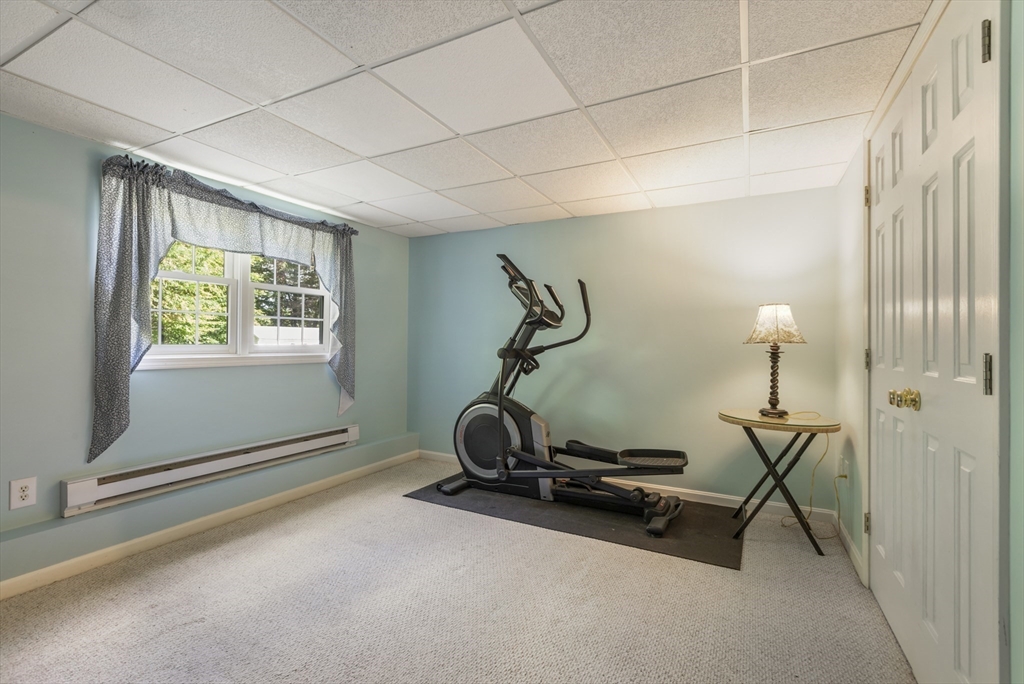 11 Old Farm Road Douglas, MA 01516 - Photo 34 of 42 a room with gym equipment and a window
