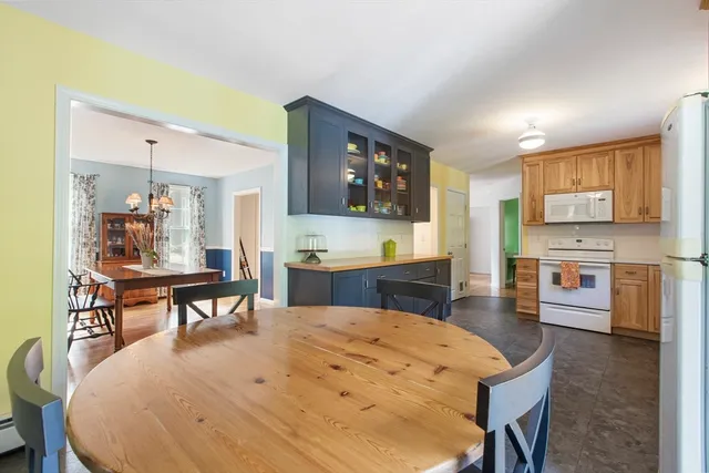 a open kitchen with stainless steel appliances kitchen island granite countertop a sink and cabinets