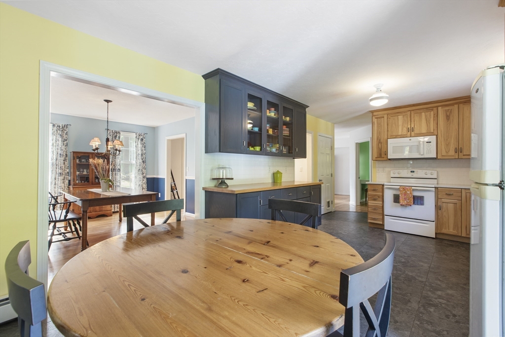 11 Old Farm Road Douglas, MA 01516 - Photo 5 of 42 a open kitchen with stainless steel appliances kitchen island granite countertop a sink and cabinets