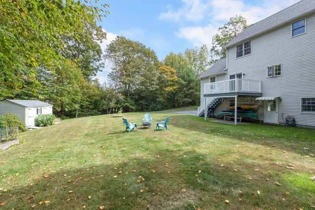 a view of a house with a backyard