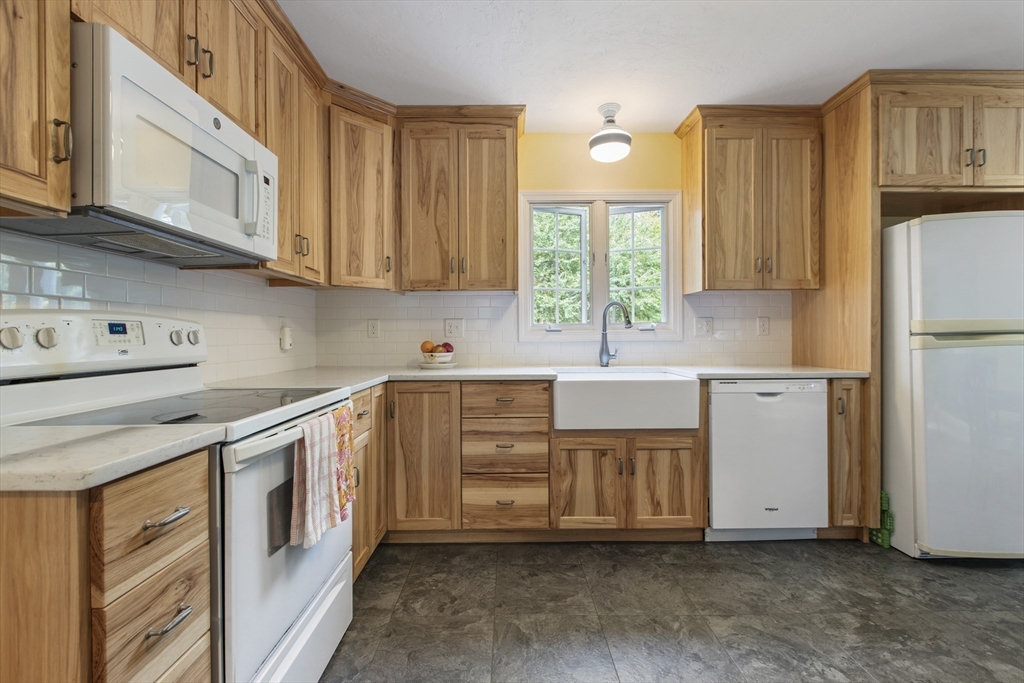 11 Old Farm Road Douglas, MA 01516 - Photo 8 of 42 a kitchen with stainless steel appliances granite countertop a sink a stove and a refrigerator