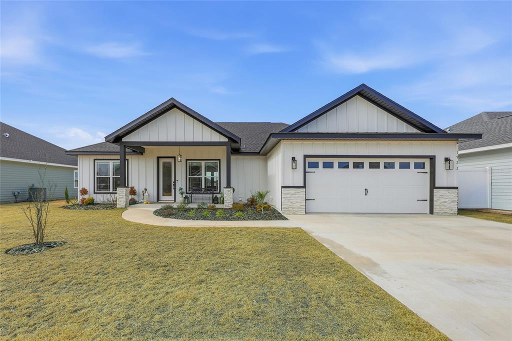 a view of a house with swimming pool and porch