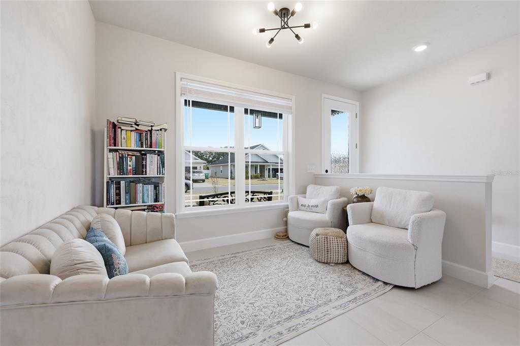 1922 Southwest 244th Way Newberry, FL 32669 - Photo 14 of 31 a living room with furniture and a large window