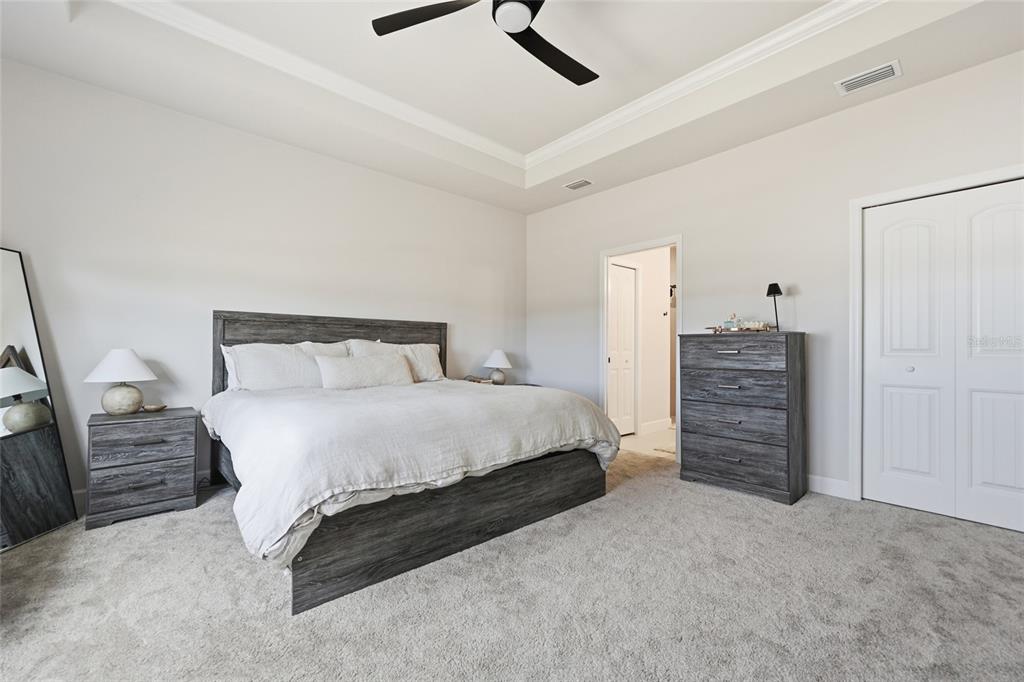 1922 Southwest 244th Way Newberry, FL 32669 - Photo 16 of 31 a bedroom with a bed and furniture