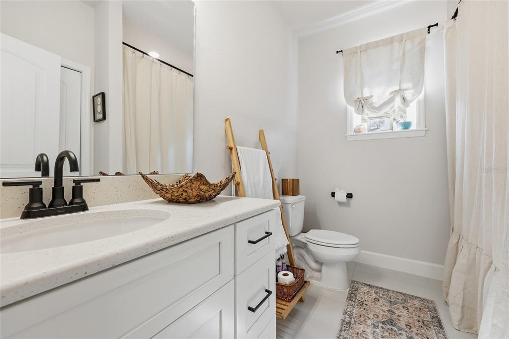 1922 Southwest 244th Way Newberry, FL 32669 - Photo 22 of 31 a bathroom with a sink and a toilet