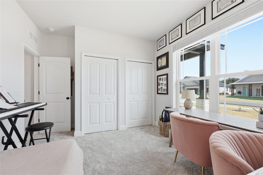 1922 Southwest 244th Way Newberry, FL 32669 - Photo 23 of 31 a living room with stainless steel appliances kitchen island granite countertop furniture and a livingroom view
