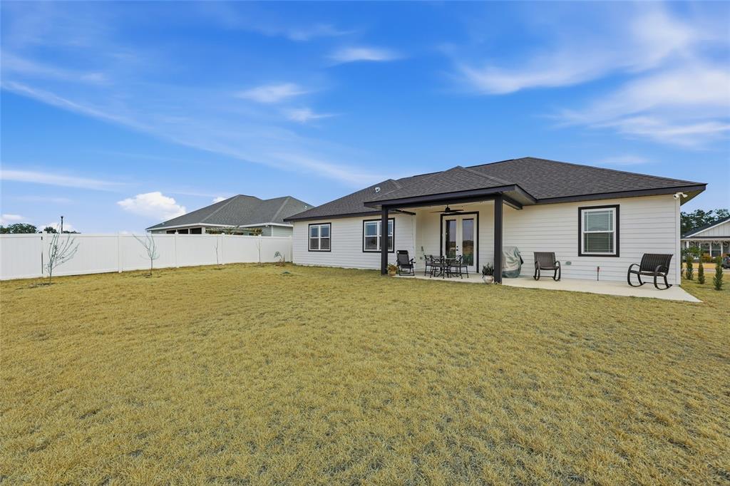 1922 Southwest 244th Way Newberry, FL 32669 - Photo 24 of 31 a front view of a house with swimming pool