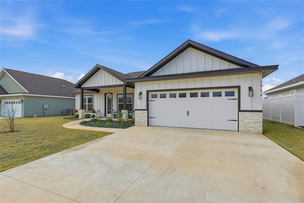 1922 Southwest 244th Way Newberry, FL 32669 - Photo 25 of 31 a view of a house with swimming pool and a yard