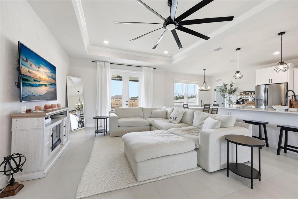 1922 Southwest 244th Way Newberry, FL 32669 - Photo 7 of 31 a living room with furniture and a flat screen tv