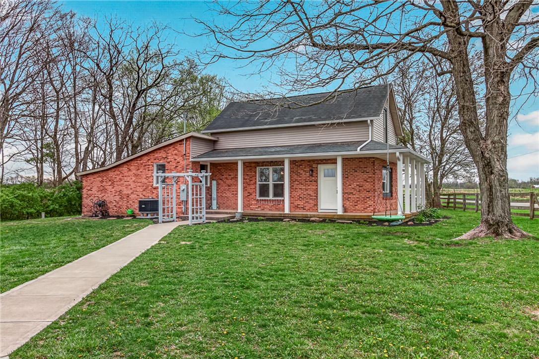 8700 Quaker Trace Road Camden, OH 45311 - Photo 1 of 34 This charming brick and siding residence features a welcoming front porch and mature trees.