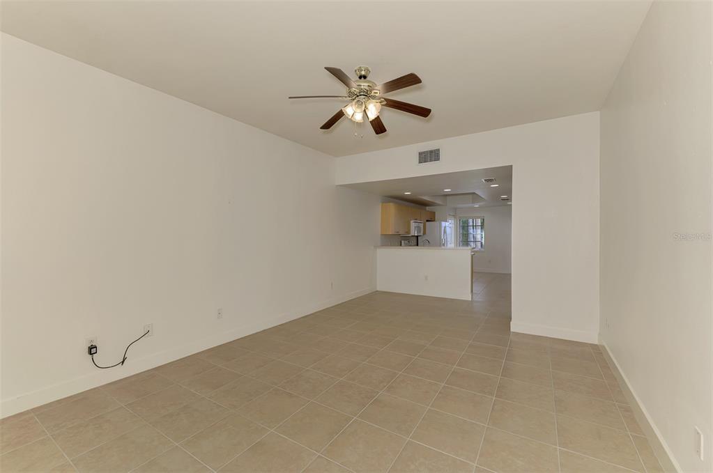 1246 Rio De Janeiro Avenue, Unit 510 Punta Gorda, FL 33983 - Photo 16 of 52 a view of empty room with window and ceiling fan