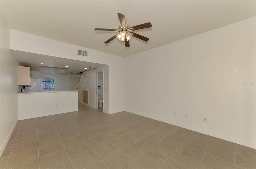 1246 Rio De Janeiro Avenue, Unit 510 Punta Gorda, FL 33983 - Photo 17 of 52 a view of an empty room with a ceiling fan