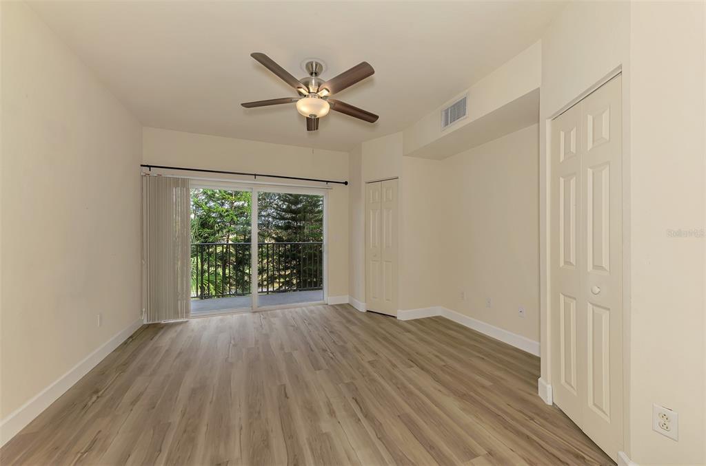 1246 Rio De Janeiro Avenue, Unit 510 Punta Gorda, FL 33983 - Photo 20 of 52 a view of an empty room with wooden floor and a window