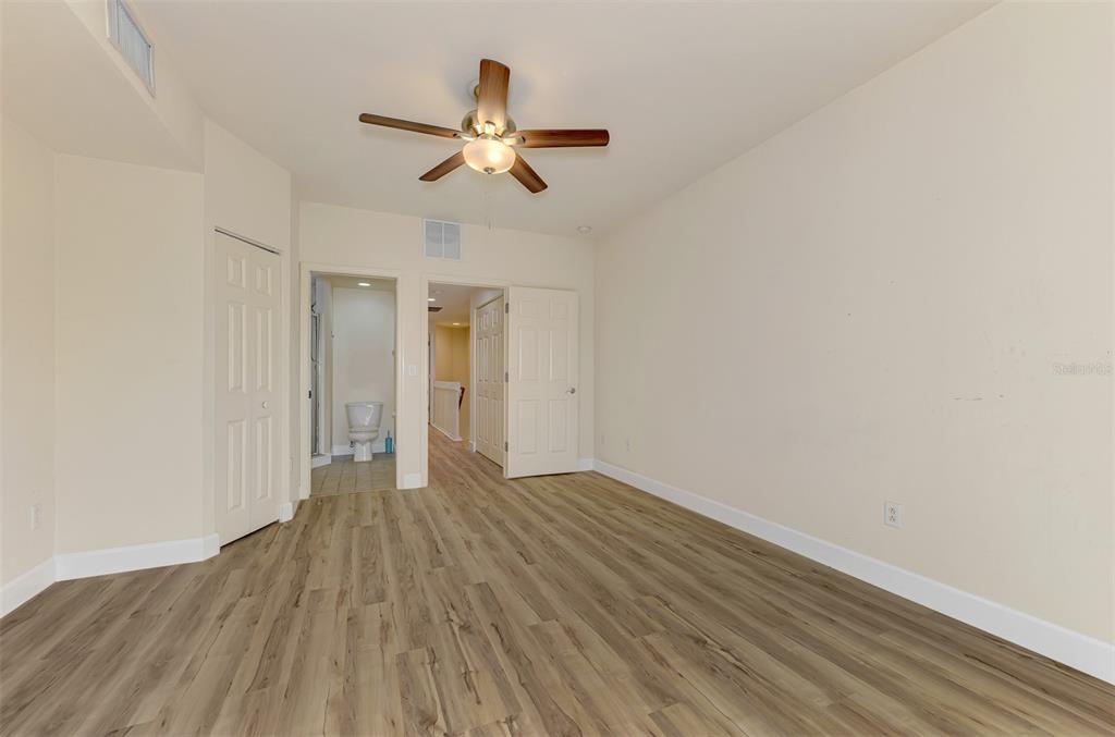 1246 Rio De Janeiro Avenue, Unit 510 Punta Gorda, FL 33983 - Photo 22 of 52 a view of an empty room with wooden floor