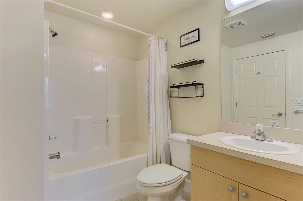 1246 Rio De Janeiro Avenue, Unit 510 Punta Gorda, FL 33983 - Photo 30 of 52 a bathroom with a sink toilet and shower