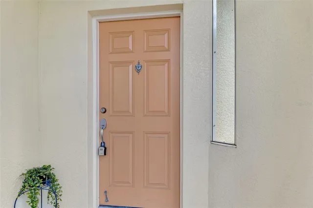 a view of staircase with lots of windows and white walls