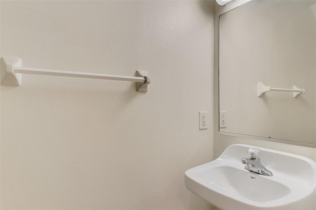 1246 Rio De Janeiro Avenue, Unit 510 Punta Gorda, FL 33983 - Photo 33 of 52 a bathroom with a sink and a mirror