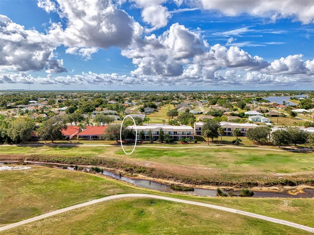 1246 Rio De Janeiro Avenue, Unit 510 Punta Gorda, FL 33983 - Photo 45 of 52 a view of a swimming pool with an ocean view