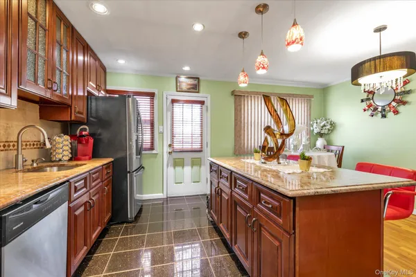a kitchen with a sink stove and refrigerator