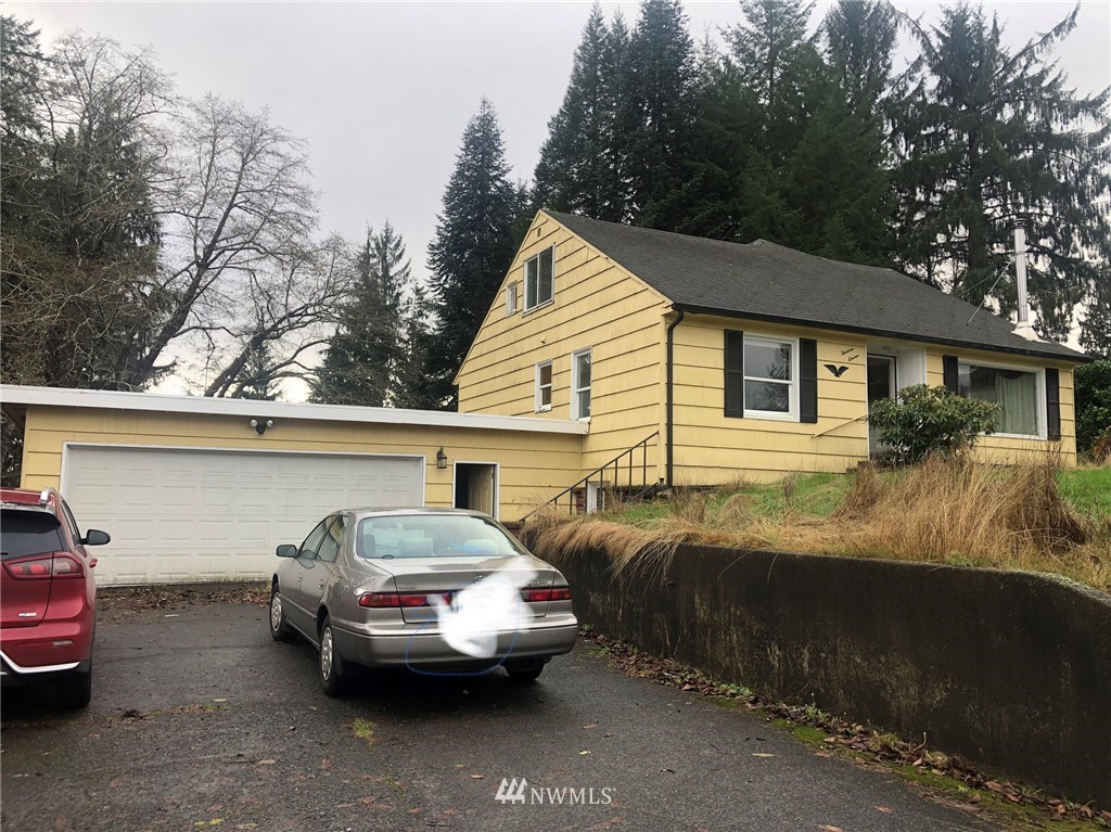 1311 McClellan Street Aberdeen, WA 98520 - Photo 2 of 29 a view of a car parked in front of a house