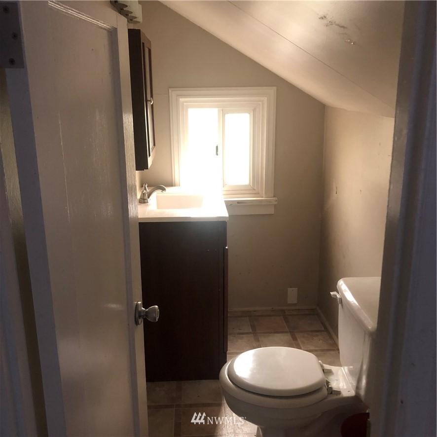 1311 McClellan Street Aberdeen, WA 98520 - Photo 18 of 29 a bathroom with a toilet and a sink