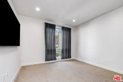 en empty room with windows