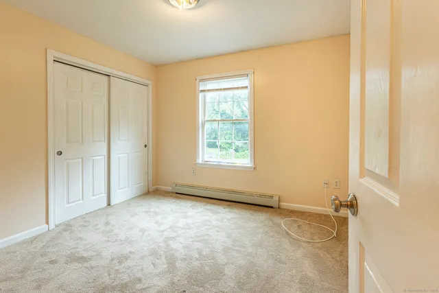 an empty room with a empty space and a window